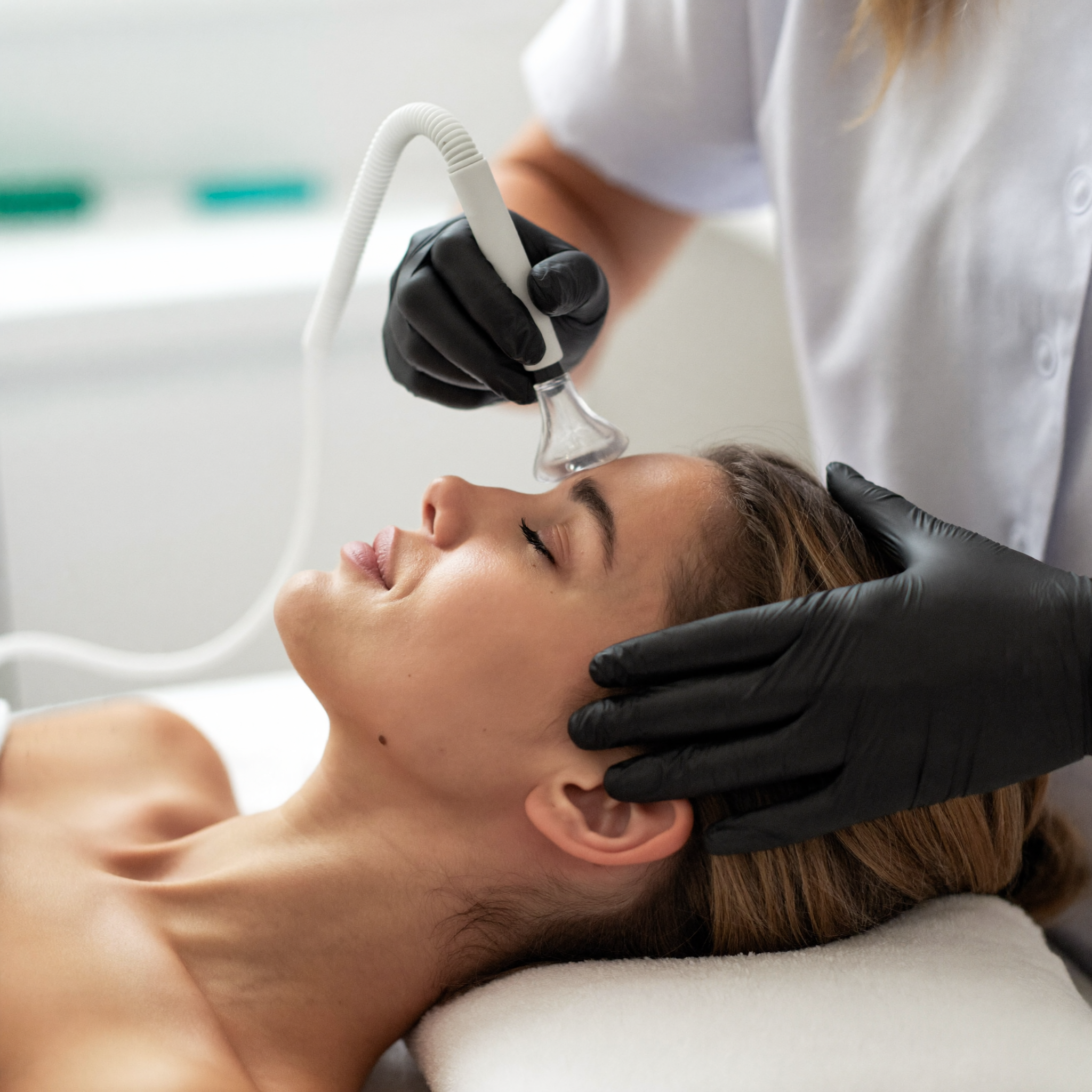 Facial cupping treatment during a facial rejuvenation session at Total Health Systems
